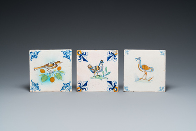 Three polychrome Delft tiles with a chicken, a crested tit and an ostrich, 17th C.