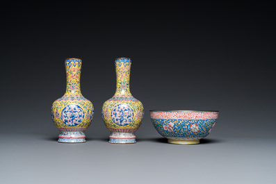 A pair of Chinese yellow-ground Canton enamel vases and a bowl, Yongzheng/Qianlong