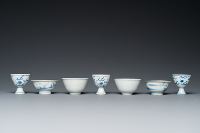 Four Chinese blue and white 'Hatcher cargo' bowls and three stem cups, Transitional period