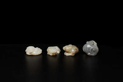 Four Chinese jade carvings with cats, a buffalo and a carp, Qing