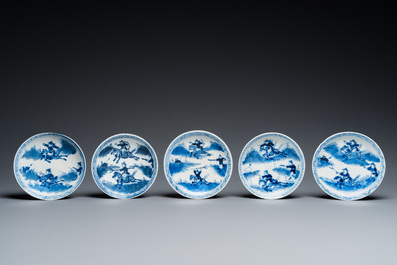 13 Chinese blue and white 'rabbit hunt' cups and 10 saucers, Qianlong mark, 19th C.