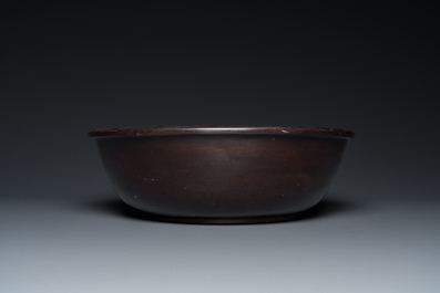 A large Chinese Fuzhou or Foochow lacquer 'tiger' bowl, inscribed 'xin qi chun', 19/20th C.