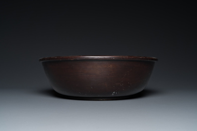 A large Chinese Fuzhou or Foochow lacquer 'tiger' bowl, inscribed 'xin qi chun', 19/20th C.