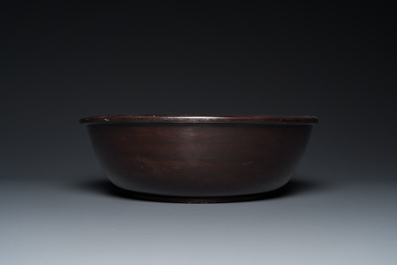 A large Chinese Fuzhou or Foochow lacquer 'tiger' bowl, inscribed 'xin qi chun', 19/20th C.