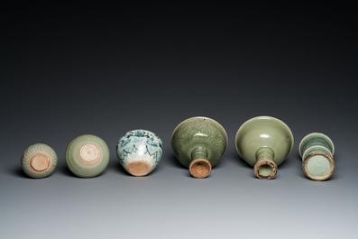 Three Chinese celadon-glazed vases, two stem cups and a blue and white vase, Ming