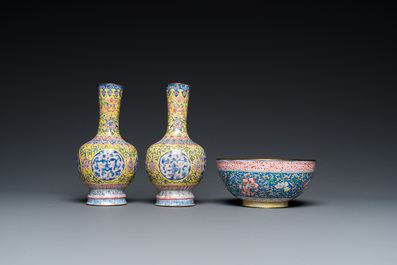 A pair of Chinese yellow-ground Canton enamel vases and a bowl, Yongzheng/Qianlong