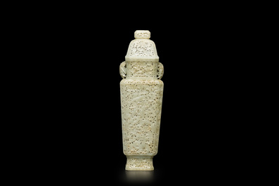 A Chinese reticulated celadon jade vase and cover, Republic