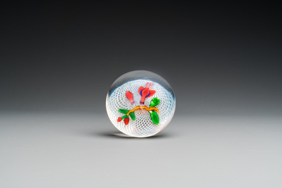 A glass Saint Louis paperweight with fuchsia on a latticinio-ground, ca. 1850