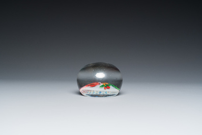 A glass Saint Louis paperweight with fuchsia on a latticinio-ground, ca. 1850