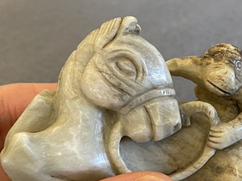 A Chinese greyish green jade 'horse and monkey' carving, probably Ming