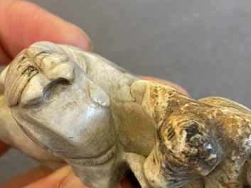 A Chinese greyish green jade 'horse and monkey' carving, probably Ming