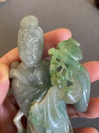 A Chinese jade sculpture of a lady on a wooden stand, Qing
