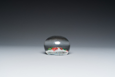 A glass Saint Louis paperweight with fuchsia on a latticinio-ground, ca. 1850