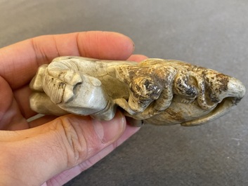 A Chinese greyish green jade 'horse and monkey' carving, probably Ming