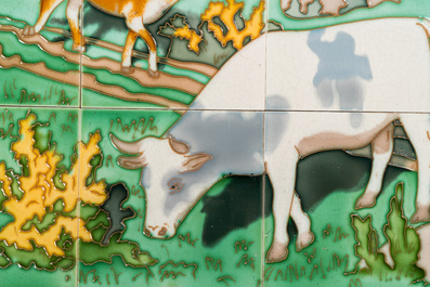 An Art Nouveau tile mural with a shepherdess and her cows in a meadow, Gilliot &amp; Cie., Hemiksem