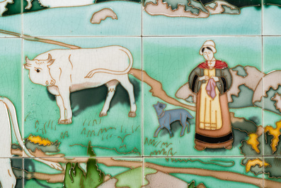 Een Art Nouveau tegeltableau met een boerin en haar koeien in een wei, Gilliot &amp; Cie., Hemiksem