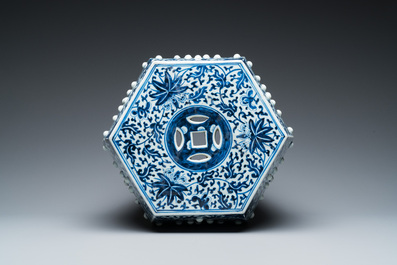 A Chinese blue and white hexagonal garden seat with floral design, 19th C.