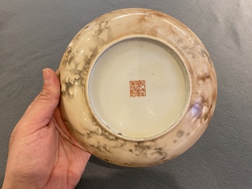 A Chinese faux-marble painted porcelain plate with a poem and Tang Ying mark, Qianlong mark, 19th C.