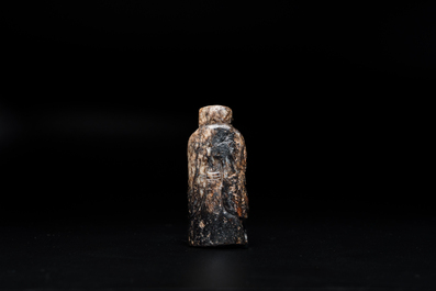 A Chinese black and grey jade figural pendant, Han Dynasty