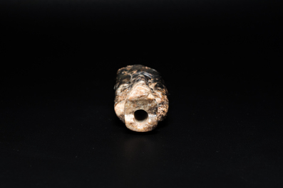 A Chinese black and grey jade figural pendant, Han Dynasty