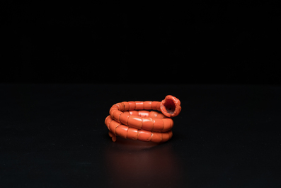 A Chinese red coral bracelet with a dragon's or snake's head, 19th C.