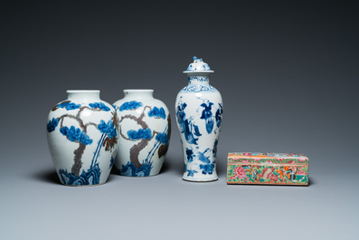 A pair of Chinese blue, white and copper-red vases, a blue and white covered vase and a Canton famille rose box and cover, 19/20th C.