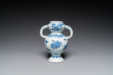 A Chinese blue and white vase with floral design, Transitional period
