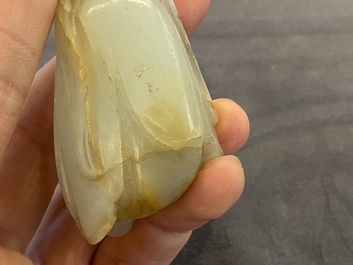 A Chinese white jade snuff bottle and a green jade 'Buddha hand' pendant, Qing