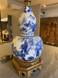 A Chinese blue and white double gourd vase mounted as a lamp, Transitional period