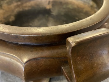 A Chinese lotus-shaped bronze tripod censer, late Ming or early Qing