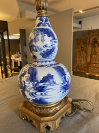 A Chinese blue and white double gourd vase mounted as a lamp, Transitional period