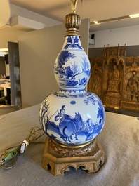 A Chinese blue and white double gourd vase mounted as a lamp, Transitional period