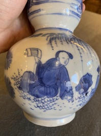 A Chinese blue and white double gourd vase with figures in a landscape, Transitional period