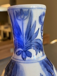 A Chinese blue and white double gourd vase with figures in a landscape, Transitional period