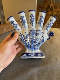 A Dutch Delft blue and white tulip vase with floral design, 18th C.