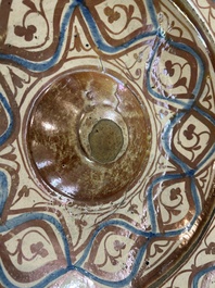 A large Hispano-Moresque lustre-glazed dish with ornamental design, Spain, 16th C.