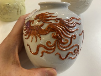 A Chinese yellow-glazed biscuit teapot, a white-glazed biscuit double gourd vase and an iron-red 'phoenix' jar, 20th C.