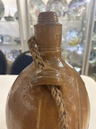 Two German stoneware bellarmine jugs and a pilgrim's flask, 17th C.