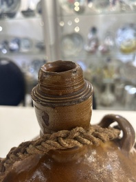 Two German stoneware bellarmine jugs and a pilgrim's flask, 17th C.