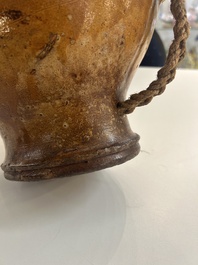 Two German stoneware bellarmine jugs and a pilgrim's flask, 17th C.