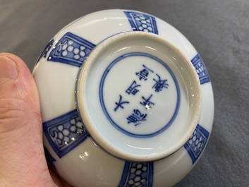 A pair of small Chinese blue and white covered vases on wooden stands, Xuande mark, 19/20th C.