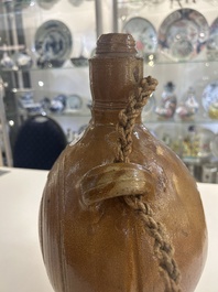 Two German stoneware bellarmine jugs and a pilgrim's flask, 17th C.