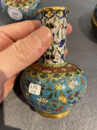 Three Chinese cloisonn&eacute; vases and a covered box, 19/20th C.