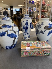 A pair of Chinese blue, white and copper-red vases, a blue and white covered vase and a Canton famille rose box and cover, 19/20th C.