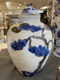 A pair of Chinese blue, white and copper-red vases, a blue and white covered vase and a Canton famille rose box and cover, 19/20th C.