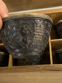 20 Chinese coconut 'Shou' cups in wooden presentation boxes, 19/20th C.