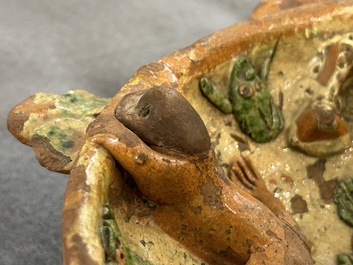 A slip-decorated three-handled earthenware bowl, probably Germany, 16/17th C.