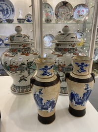 A pair of Chinese famille verte vases with covers and a pair of Nanking vases, 19th C.