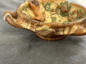 A slip-decorated three-handled earthenware bowl, probably Germany, 16/17th C.