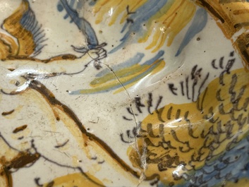 A small polychrome maiolica dish with a fighting putto, Verstraeten workshop, Haarlem, 17th C.